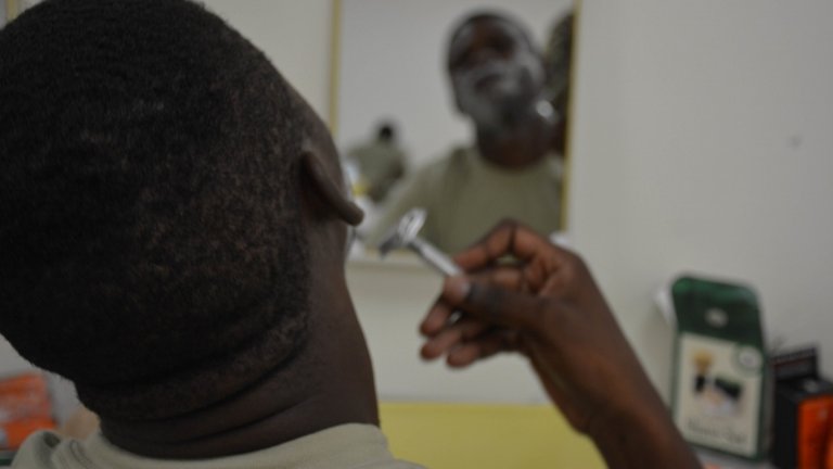 A Soldier assigned to the 3rd Infantry Division Sustainment Brigade uses a single-blade razor to shave his face during a shaving clinic May 22 at the brigade's organizational classroom.