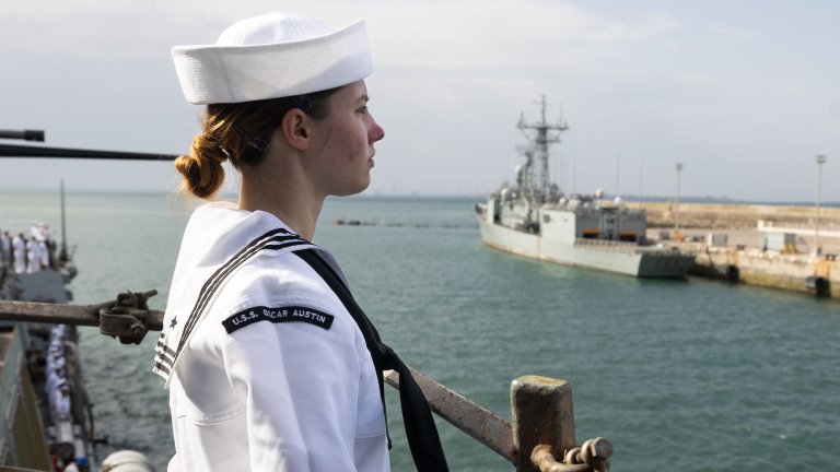 250610-N-FS061-2001 NAVAL STATION ROTA, Spain – (Jun. 10, 2025) Cryptologic Technician (Collection) 3rd Class Tylar Keenan, assigned to the Arleigh Burke-class guided missile-destroyer USS Oscar Austin (DDG 79), mans the rail during sea and anchor detail as the ship returns to Naval Station (NAVSTA) Rota, Spain after patrol, Jun. 10, 2025. Oscar Austin completed its first patrol in the U.S. Naval Forces Europe area of operations, employed by U.S. 6th Fleet to defend U.S., Allied, and partner interests in the region. (U.S. Navy photo by Mass Communication Specialist Seaman Jasmin L. Aquino)