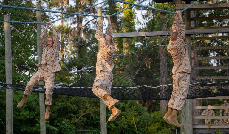 Recruits with Golf Company, 2nd Recruit Training Battalion, conduct the Confidence Course on Marine Corps Recruit Depot Parris Island, S.C., June 25, 2024. After demonstrations, recruits complete various physically and mentally challenging obstacles. (U.S. Marine Corps photo by Lance Cpl. Ayden Cassano)