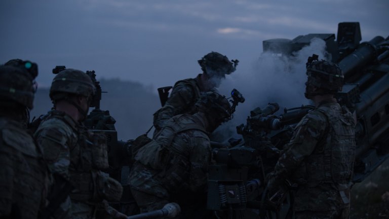 U.S. Paratroopers assigned to Chaos Battery, 4th Battalion, 319th Airborne Field Artillery Regiment, 173rd Airborne Brigade, fire an M777A2 during a live fire exercise following a heavy drop airborne operation at Grafenwoehr, Germany, Oct. 05, 2023. The 173rd Airborne Brigade is the U.S. Army Contingency Response Force in Europe, capable of projecting ready forces anywhere in the U.S. European, Africa or Central Commands' areas of responsibility. (U.S. Army photo by Kevin Sterling Payne)