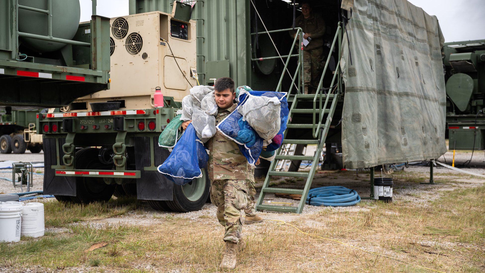 U.S. Army Spc. Luke Tilley, a shower and laundry specialist from the 1225th Combat Sustainment Support Battalion, 464th Quartermaster Company, Michigan Army National Guard, process laundry from service members in the field during Exercise Northern Strike 24-2 at Camp Grayling, Michigan, Aug. 10, 2024. Northern Strike 24-2, one of the Department of Defense's largest reserve component readiness exercises, is scheduled to take place at Michigan's National All Domain Warfighting Center (NADWC) from August 3-17, 2024. Over 6,300 participants from 32 states and territories and several international participants will converge at the NADWC. Northern Strike is the premier reserve component training event designed to build readiness with joint and partner forces in all domains of warfare. (U.S. Air National Guard photo by Master Sgt. Scott Thompson)