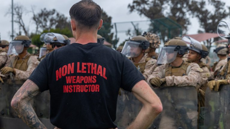 U.S. Marines with 2nd Battalion, 7th Marine Regiment, 1st Marine Division, attached to Task Force 51, rehearse non-lethal tactics in Los Angeles, June 11, 2025. U.S. Northern Command is supporting federal agencies by providing military forces to protect federal functions, personnel, and property in the greater Los Angeles area. On June 7, the Secretary of Defense directed USNORTHCOM to establish Task Force 51 to oversee Title 10 forces supporting this mission. (U.S. Marine Corps photo by Cpl. Jaye Townsend)