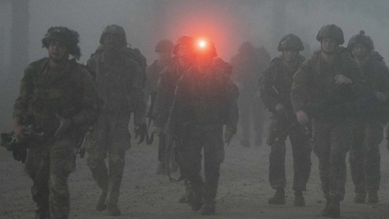 Paratroopers assigned to the 82nd Airborne Division, walk the final mile of the 12-mile ruck march during E3B on Fort Liberty, North Carolina, Sept. 21, 2024. E3B is a week-long testing event that gives Soldiers the opportunity to earn the Expert Infantryman Badge, Expert Soldier Badge, or Expert Field Medical Badge. Soldiers must pass the expert physical fitness assessment, day and night land navigation, soldier tasks including weapons, medical and patrol lanes, and a 12-mile ruck march, in order to earn their badge. (U.S. Army photo by Staff Sgt. Catessa Palone)